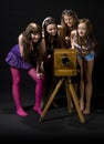 Teen girls and antique camera Royalty Free Stock Photo