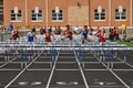 Teen Girls Competing in High School Hurdles Race