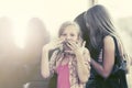 Teen girls looking through the mall window Royalty Free Stock Photo