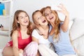 Teen girls with smartphone taking selfie at home Royalty Free Stock Photo