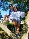 Teen girls sitting in a tree in Cleveland, Ohio Royalty Free Stock Photo