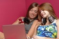 Teen girls using electronics