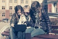 Teen girls using laptop on the bench Royalty Free Stock Photo