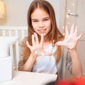 Teen hands disinfect with soap automatic dispenser