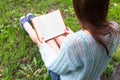 Teen happy girl read a book in city park outdoor Royalty Free Stock Photo