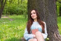 Teen happy girl read a book in city park outdoor Royalty Free Stock Photo