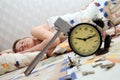 Teen has broken an alarm clock and sleep Royalty Free Stock Photo