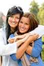 Teen and her mother embracing outdoors bonding Royalty Free Stock Photo
