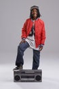 Teen, hip hop and portrait with radio for music and dance in a studio with urban clothing. Fashion, African person and Royalty Free Stock Photo