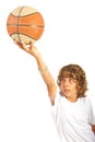 Teen holding up basketball