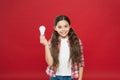 Teen kid showing lamp bulb. girl lighting lamp. inspired child brainstorming. electricity energy business idea. got a