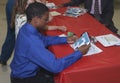 Teen looks at a school letter he got in lieu of an award Royalty Free Stock Photo