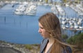 Teen Looking Sideways Over Marina Royalty Free Stock Photo