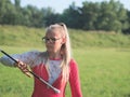 Teen Majorette Girl Twirling Baton Outdoors