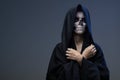 Teen with makeup closed skull hands Royalty Free Stock Photo