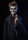 Teen with makeup skull showing thumbs up Royalty Free Stock Photo