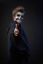 Teen with makeup skull showing thumbs up Royalty Free Stock Photo