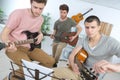 Teen music band performing on stage Royalty Free Stock Photo