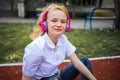 Teen Music And Happy Mood. Adolescent Music In Headphones. Cheerful Happy Girl Outdoor.