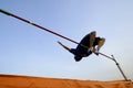 Teen over high jump bar Royalty Free Stock Photo