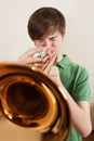 Teen playing gold trumpet Royalty Free Stock Photo