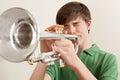 Teen playing silver trumpet Royalty Free Stock Photo