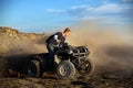 Teen on quad four wheeler