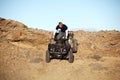 Teen on quad - four wheeler in hills Royalty Free Stock Photo