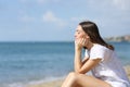 Teen relaxing on the beach a sunny summer day Royalty Free Stock Photo