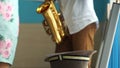 Teen saxophonist earn money