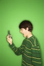 Teen screaming at cellphone. Royalty Free Stock Photo