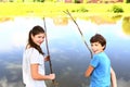 Teen siblings kids boy and girl fishing Royalty Free Stock Photo