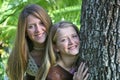 Teen Sisters By Tree Royalty Free Stock Photo