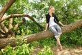 Teen sit on a branch Royalty Free Stock Photo