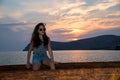 Teen sitting on dock Royalty Free Stock Photo