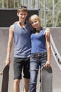 Teen skaters with boards in skatepark Royalty Free Stock Photo