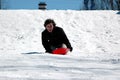 Teen sledding Royalty Free Stock Photo