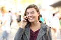 Teen smiling looking at you on the phone