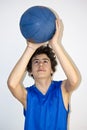 Teen sportsman holding basketball Royalty Free Stock Photo