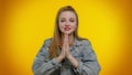 Teen student girl praying, looking upward and making wish, asking God for help, begging apology Royalty Free Stock Photo