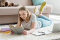 teen student girl reading book while lying