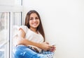 Teen student girl with smartphone at home Royalty Free Stock Photo