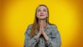 Teen stylish girl praying, looking upward and making wish, asking God for help, begging apology Royalty Free Stock Photo