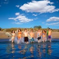 Teen surfers group running beach splashing Royalty Free Stock Photo