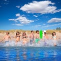 Teen surfers group running beach splashing Royalty Free Stock Photo