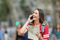 Teen tourist calling on phone in the street