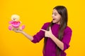 Teen with toy teddy bear with love heart for valentines day. Excited face. Teenager child girl in holding plush toy Royalty Free Stock Photo