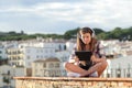 Teen watching online video or e-learning on a tablet