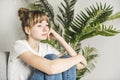 Teen woman anxious worried woman sitting on couch at home.