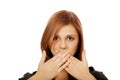 Teen woman covering her mouth with both hands Royalty Free Stock Photo